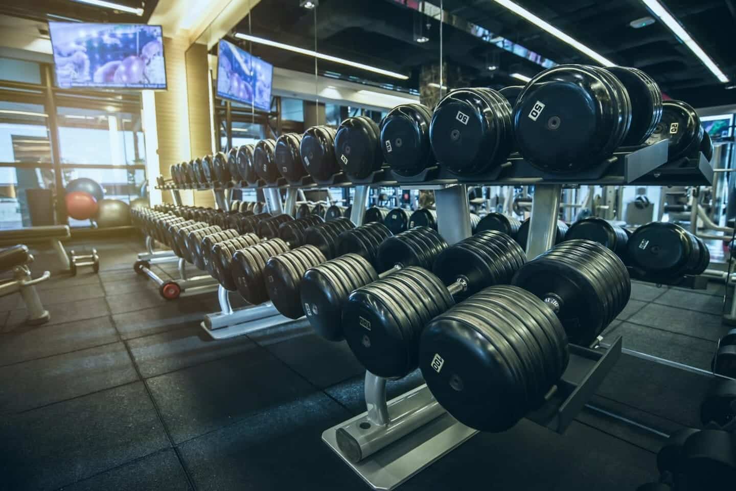 Sound Systems for Gyms help people workout more effectively - dumbells on a rack