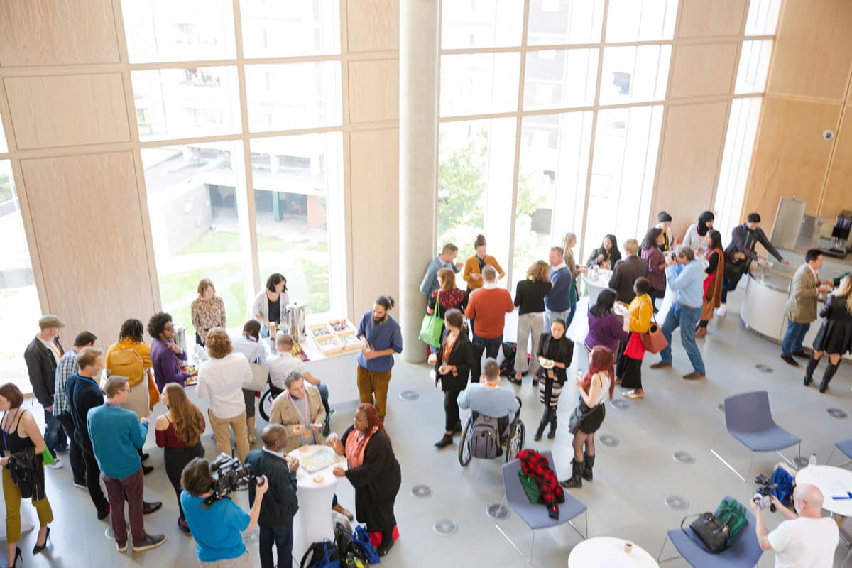 A crowd of people at an event. Get improved event experiences with commercial sound systems from Marshall Industries.