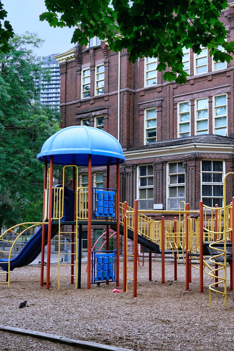School playground in front of the main building, part of the outdoor spaces Marshall Industries covers with weather-resistant AV and emergency PA systems.
